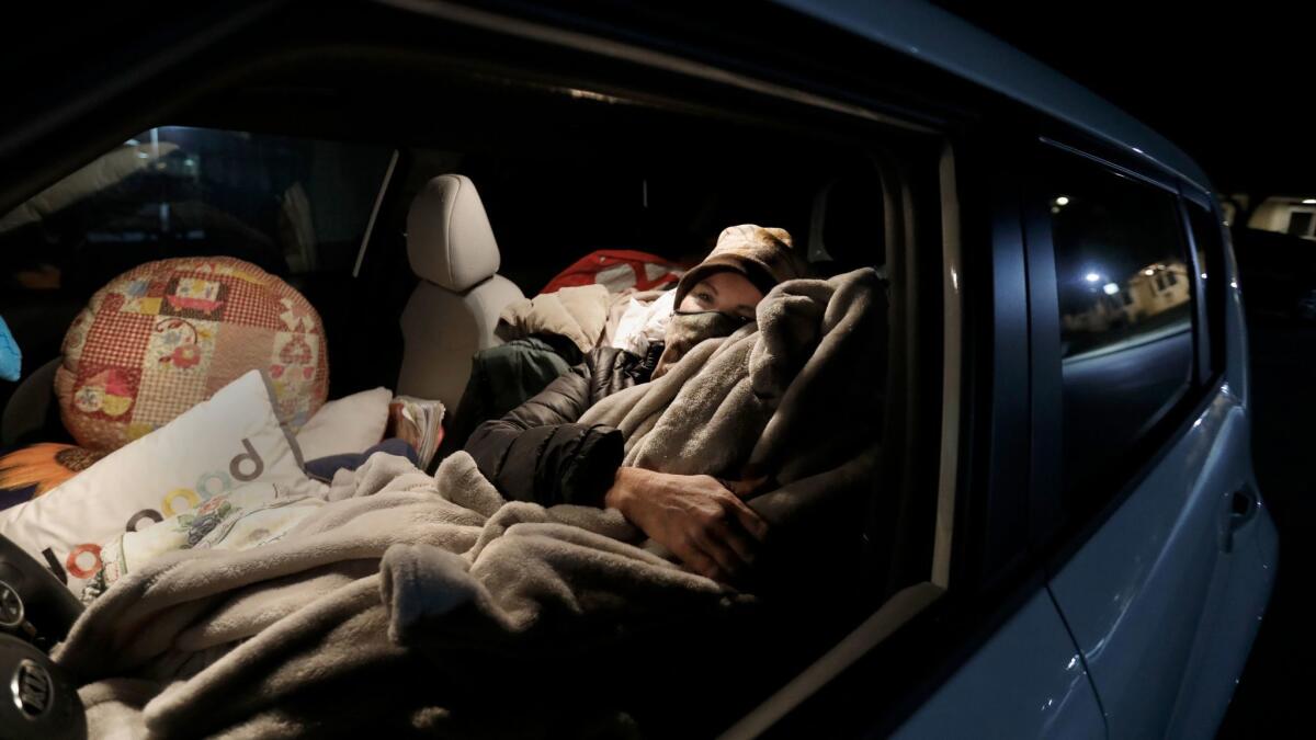 Marva Ericson, 48, gets ready to fall asleep in a Santa Barbara parking lot in the middle of the night.