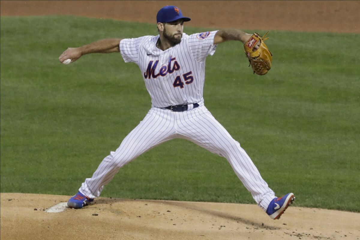 New York Mets' Michael Wacha (45) delivers a pitch during the first inning of a baseball game against the Miami Marlins Friday, Aug. 7, 2020, in New York. (AP Photo/Frank Franklin II)
