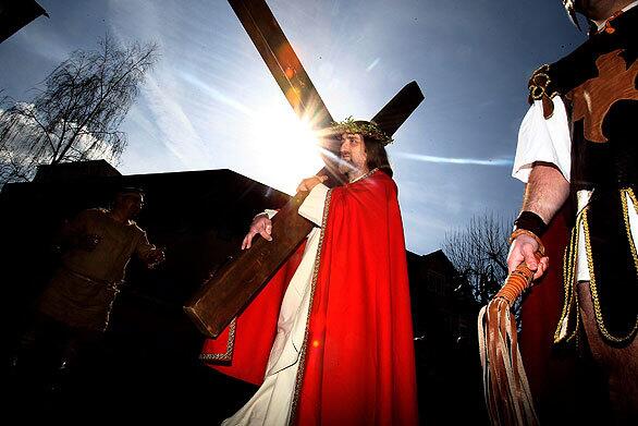 Actors reenact of the Crucifixion of Jesus by the Romans on Good Friday. Christians all over the world take part in processions retracing the steps tradition says Jesus took to his death.