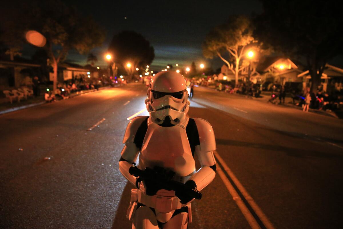 A member of the 501st Rebel Legion parades in a Storm Trooper costume during the Anaheim Halloween Parade in 2015.