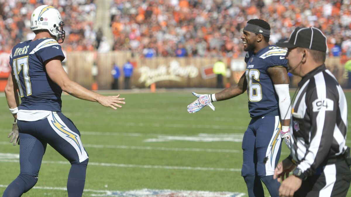 Down judge Hugo Cruz (right) was fired by the NFL after missing a call in the Chargers win' over the Browns earlier this season. The Chargers scored a touchdown on the play which should not have counted because of a missed false start penalty.