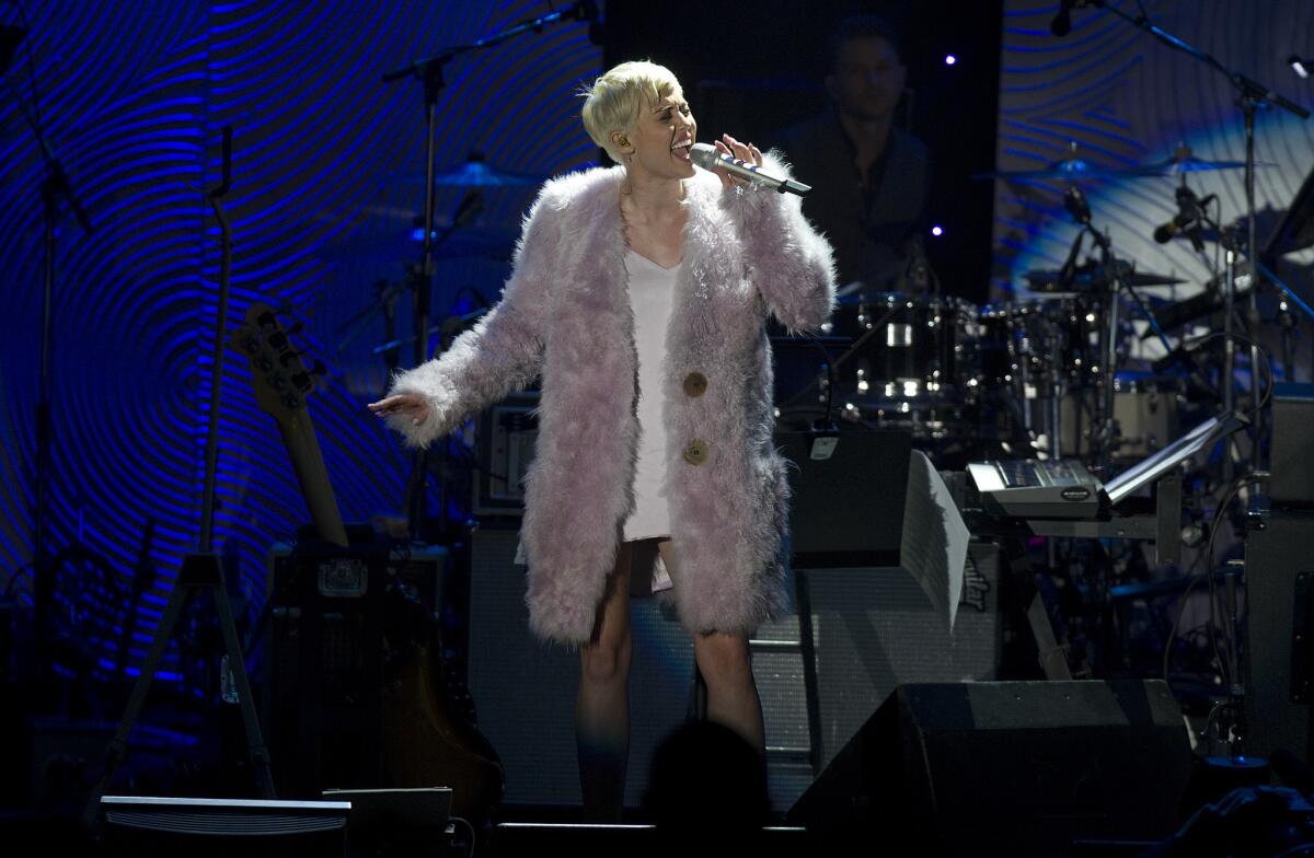 Miley Cyrus performs Saturday during Clive Davis' annual pre-Grammy Awards gala at the Beverly Hilton Hotel.
