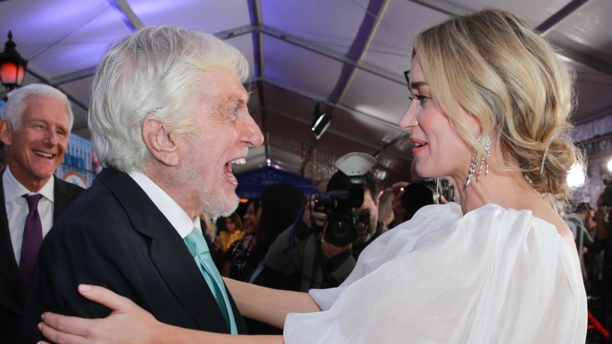 Dick Van Dyke and Emily Blunt share a moment on the red carpet for the premiere of "Mary Poppins Returns."