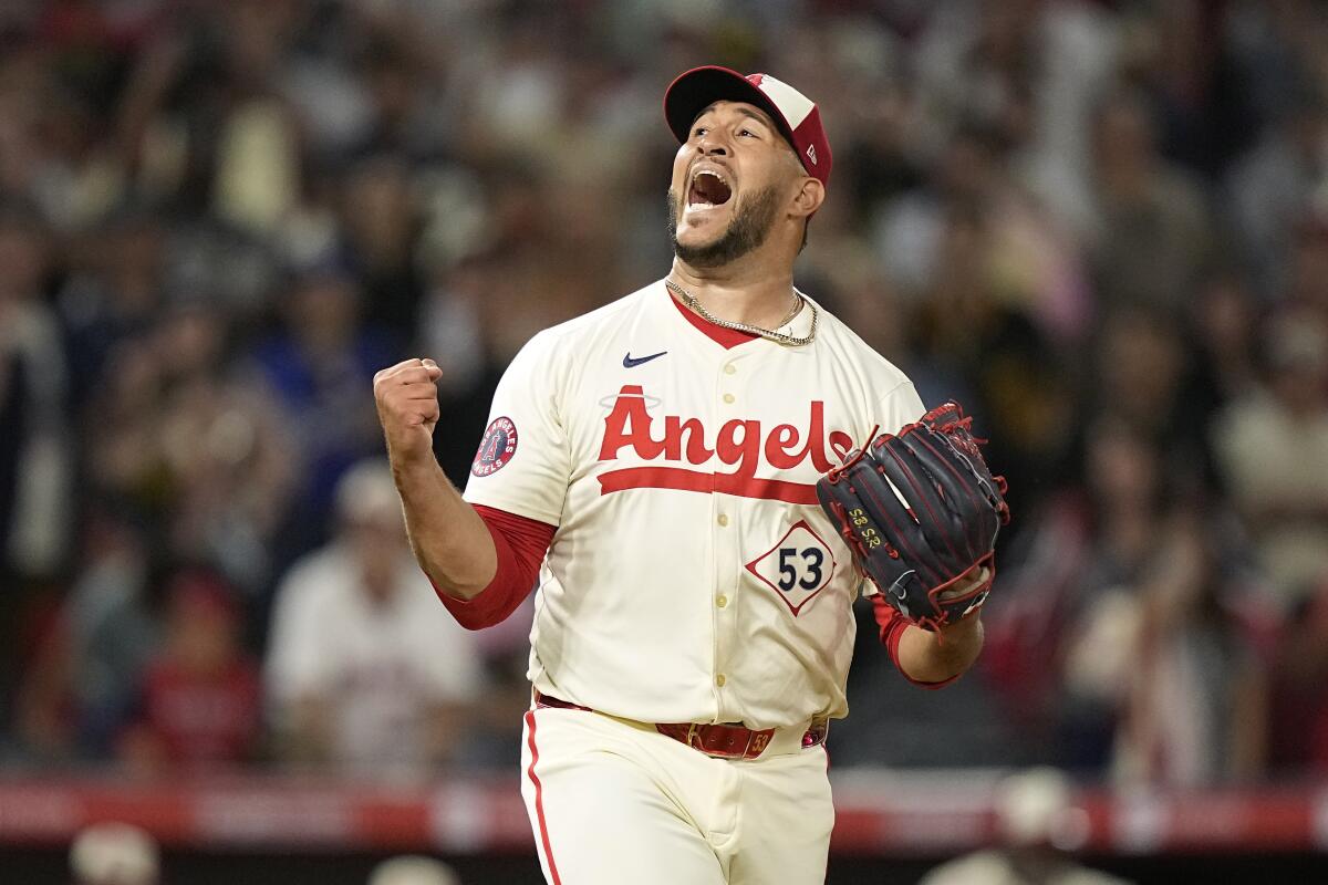 Angels closer Carlos Estévez celebrates after the final out Saturday.