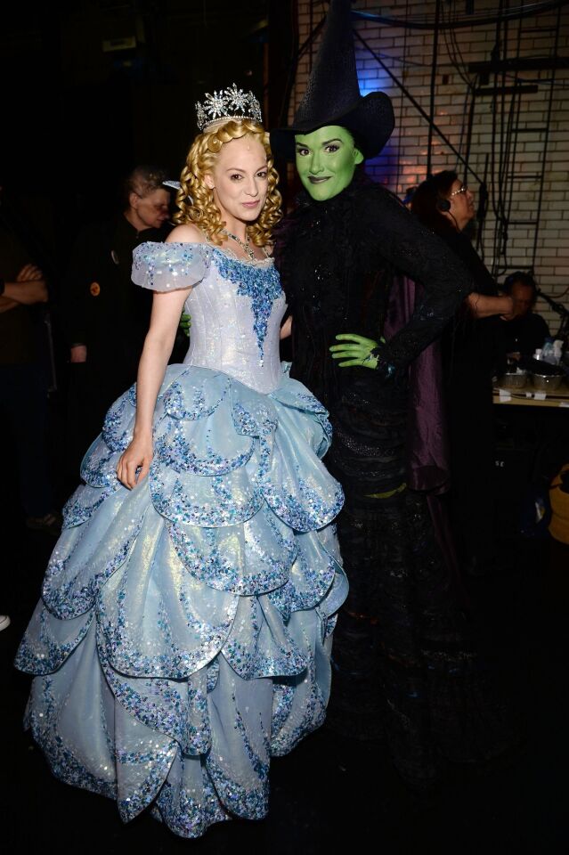 Actors Jenni Barber, left, and Christine Dwyer of "Wicked" pose backstage.