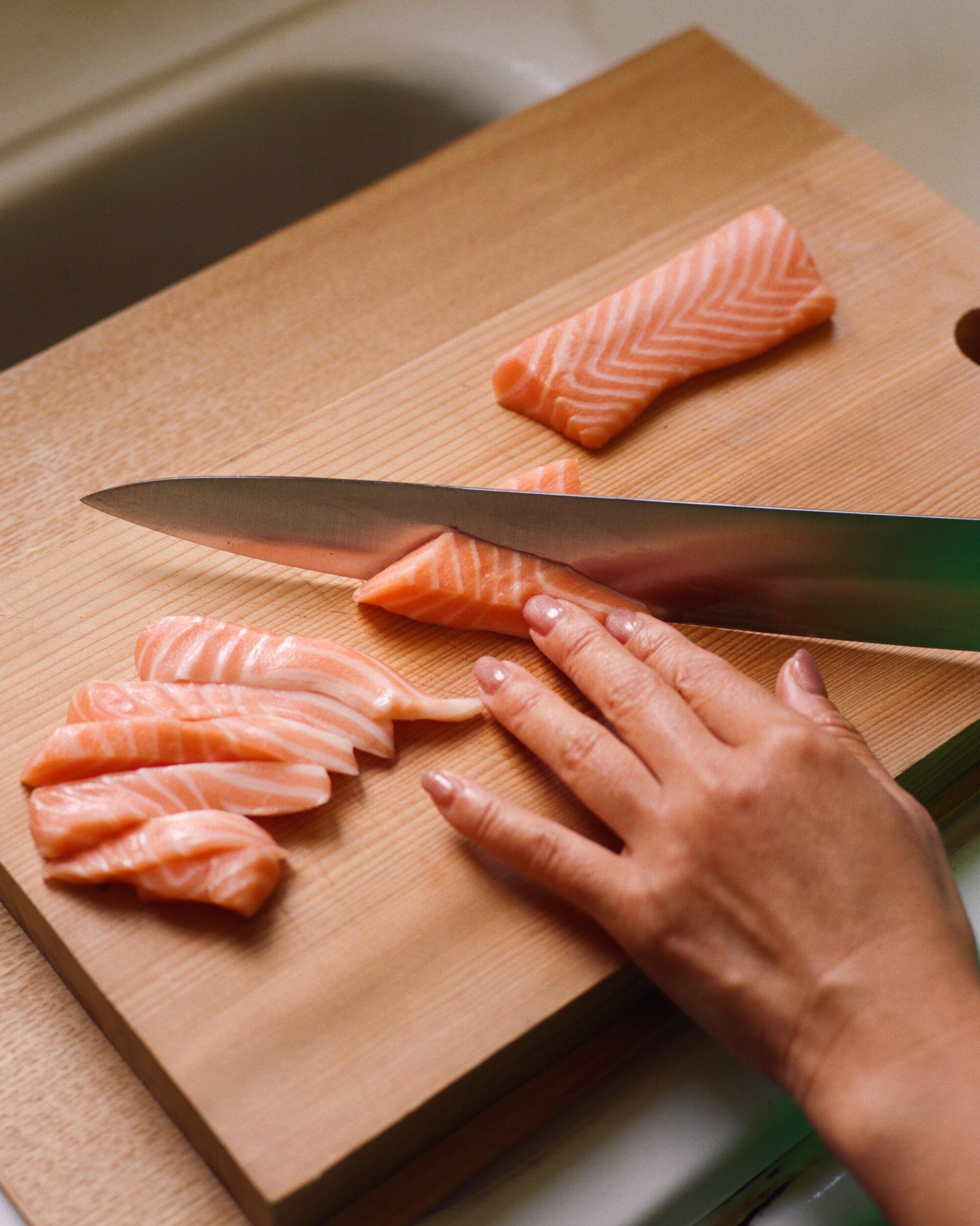 A knife slicing fish