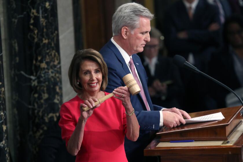Speaker of the House Nancy Pelosi (D-CA) receives the gavel from Rep. Kevin McCarthy (R-CA) during the first session of the 116th Congress at the U.S. Capitol Jan. 3 in Washington, DC. Under the cloud of a partial federal government shutdown, Pelosi reclaimed her former title as speaker and her fellow Democrats took control of the House of Representatives for the second time in eight years.