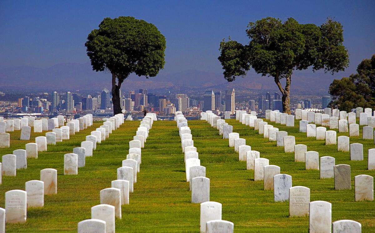 A row of headstones at Ft. Rosecrans National Cemetery, Point Loma, looking toward downtown San Diego. Read more.