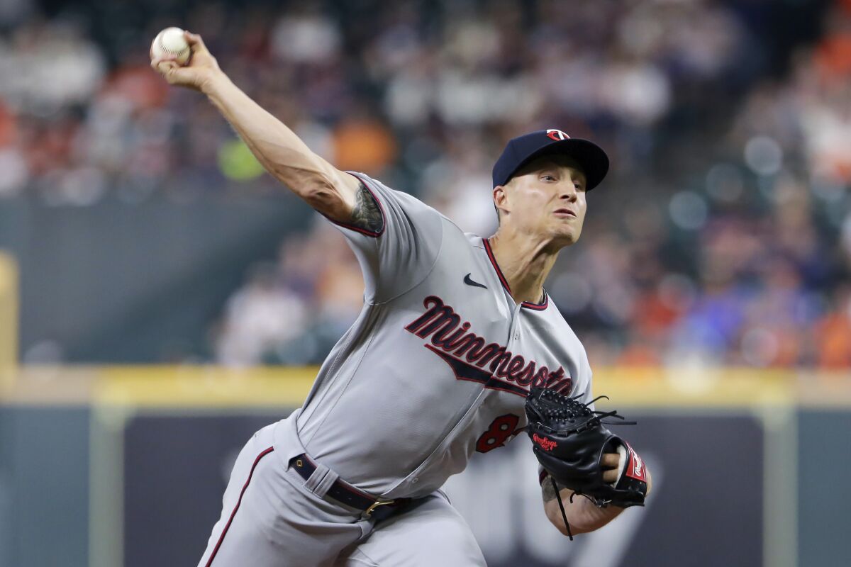 Minnesota Twins starting pitcher Griffin Jax throws to a Houston Astros batter during the first inning of a baseball game Thursday, Aug. 5, 2021, in Houston. (AP Photo/Michael Wyke)