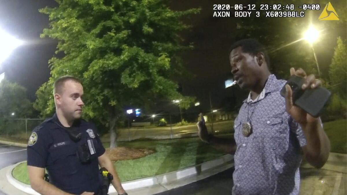 A police officer talks to a man.