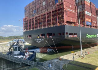A giant ship stacked high with containers