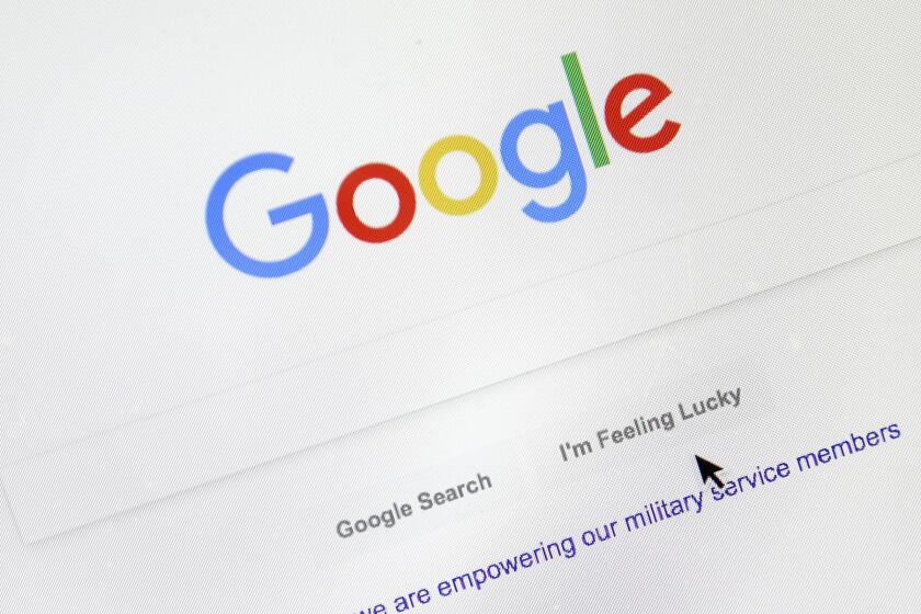FILE - In this Aug. 28, 2018, file photo, a cursor moves over Google's search engine page, in Portland, Ore. Google is paying more attention to the small words in your searches. Google is rolling out the change to English language searches in the U.S. starting this week. (AP Photo/Don Ryan, File)