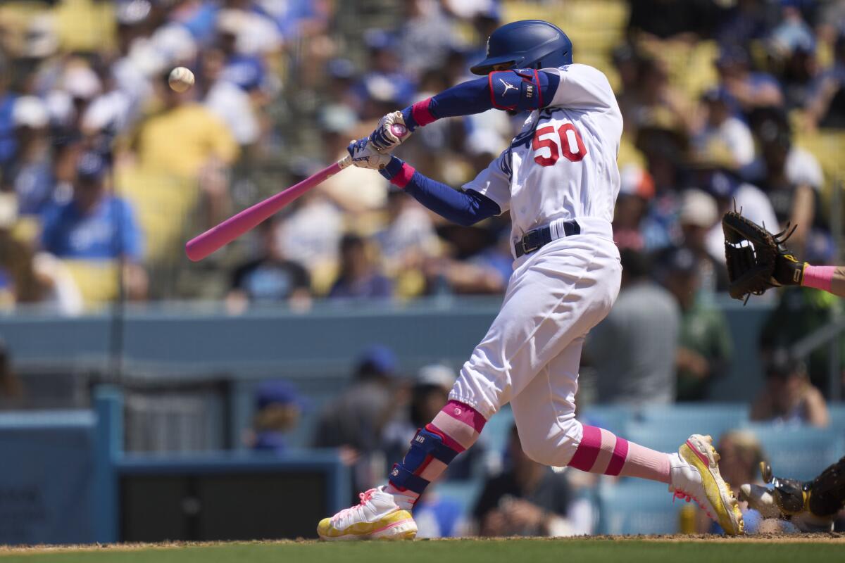 Mookie Betts flies out in the fifth inning Sunday at Dodger Stadium.
