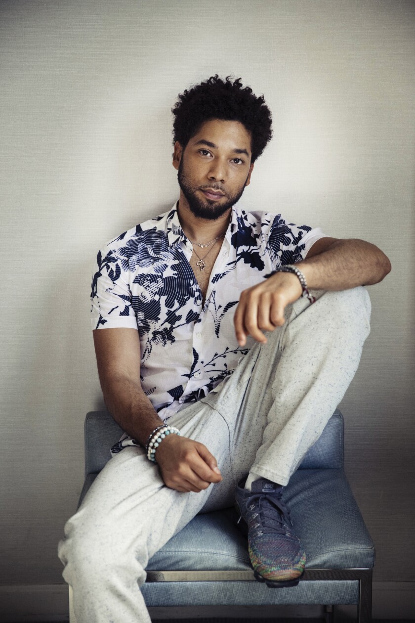 A man sitting with his knee bent in front of him
