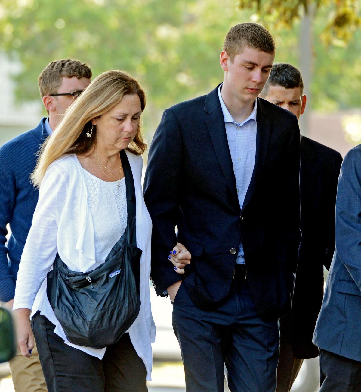 Brock Turner, right, makes his way into the Santa Clara County Superior Courthouse in Palo Alto. (Dan Honda/Bay Area News Group via AP)