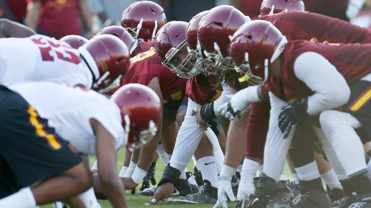 The USC offensive and defensive fronts line up against each other during the first day of training camp on Aug. 4.
