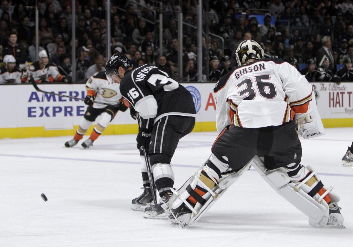 David Van der Gulik tries to control a loose puck in front of Ducks goalie John Gibson during an exhibition game in September.