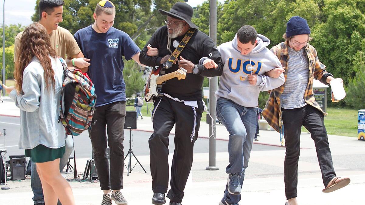 UC Irvine students and members of Chabad on Campus dance around Rabbi Blue, with guitar, after Students for Justice in Palestine disrupted a pro-Israeli film screening in May 2016.