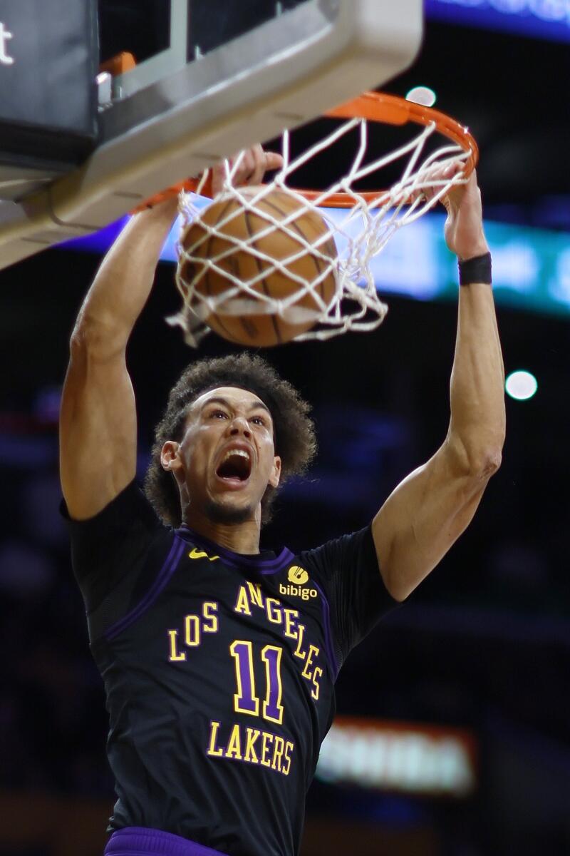 Lakers forward Jaxson Hayes dunks during the first half.