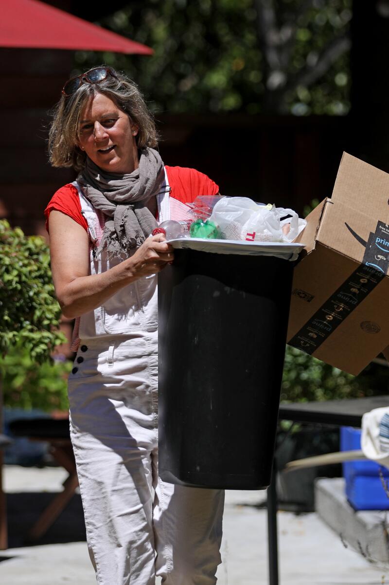 Susanne Rust with waste accumulated over a week at her home.