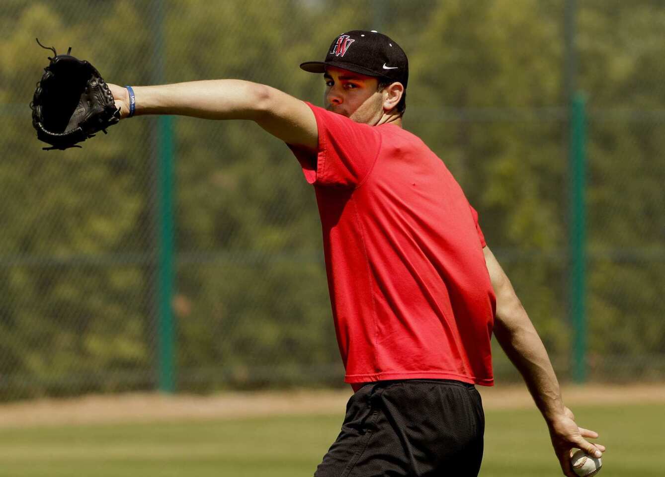 Lucas Giolito of Harvard-Westlake High pitches in public for the first time since rehabilitation from an elbow injury this spring during a workout at O'Malley Family Field in Encino.