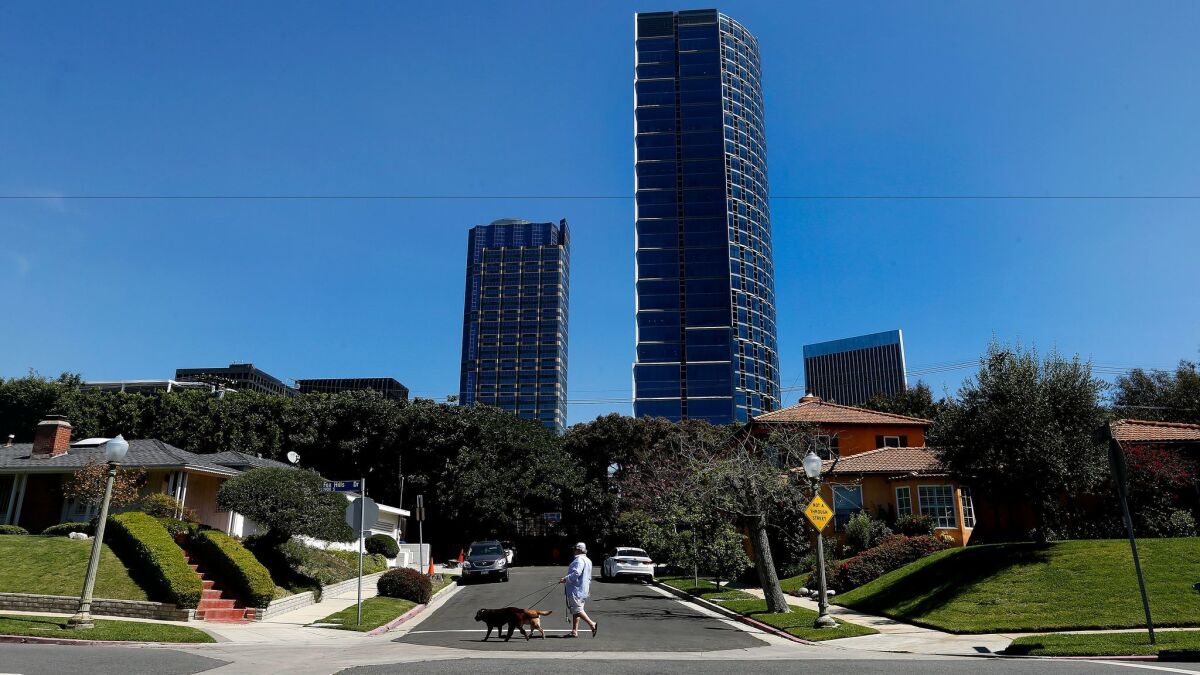 Century City skyscrapers rise above nearby homes. The area's homeowners association is in a legal fight with another nonprofit group over $3.1 million paid by the Century City mall owner as it sought to clear the way for possible changes to its parking fees.
