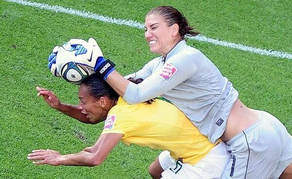 Brazil's Rosana (L) and USA's goalkeeper Hope Solo vie for the ball during the quarter final soccer match of the FIFA Women's World Cup.