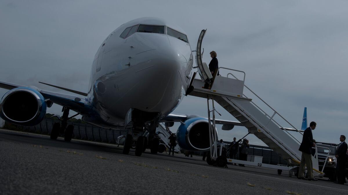 Hillary Clinton boards her campaign plane in New York the day after the first presidential debate in September.
