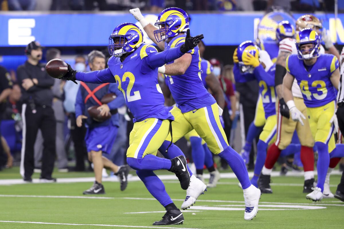 Rams linebacker Travin Howard (32) celebrates his interception in the NFC championship game.