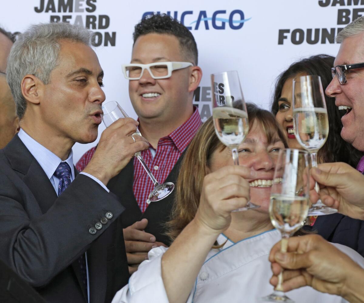 Chicago Mayor Rahm Emanuel celebrates Tuesday with some of the city's top chefs after the James Beard Foundation announced it was moving its restaurant awards show to the Windy City from New York.