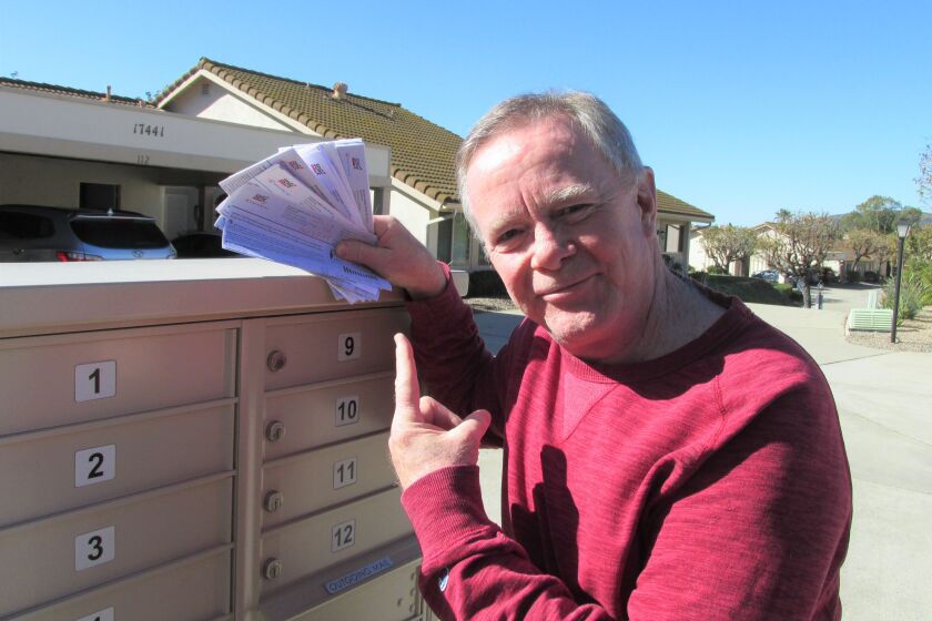 Customer Kevin Kilpatrick points to his utility bills. Rising costs prompted him to file a Small Claims Court against SDG&E.