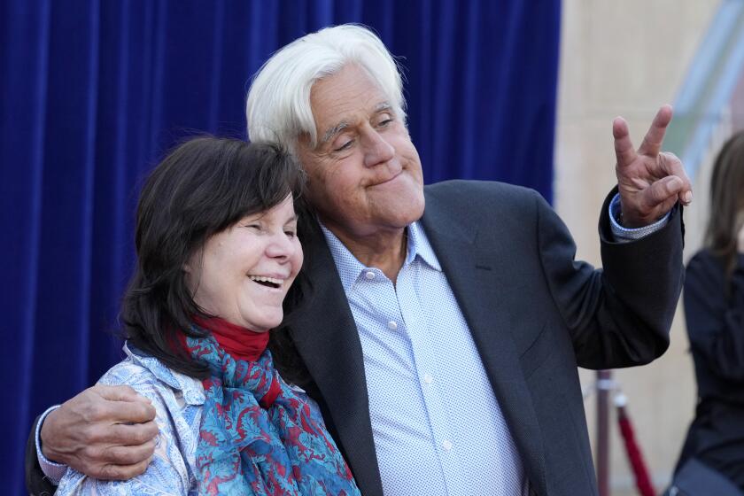 Jay Leno and his wife Mavis pose at the Apr. 30 premiere of "Unfrosted" at the Egyptian Theatre