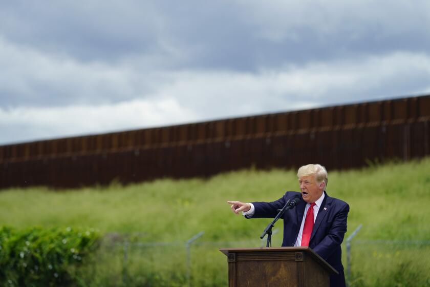 Former President Donald Trump speaks during a visit to an unfinished section of border wall with Texas Gov. Greg Abbott, in Pharr, Texas, Wednesday, June 30, 2021. (AP Photo/Eric Gay)