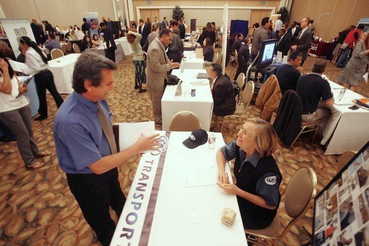 Hundreds of workers seeking jobs attend the Orange County Job Fair at the Hyatt Regency in Irvine March 5, 2013.