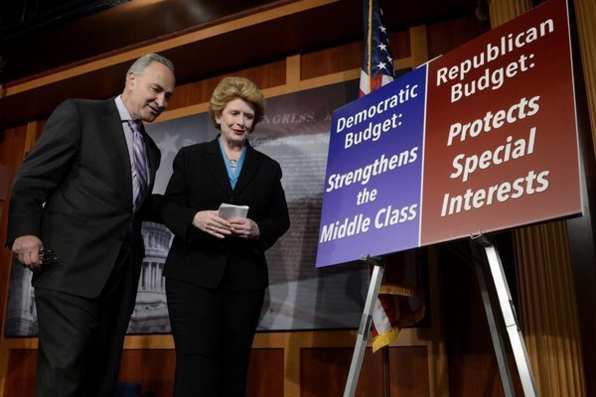 Democratic Senators Chuck Schumer, left, and Debbie Stabenow are seen at the conclusion of a news conference held by Senate Democrats on Capitol Hill.