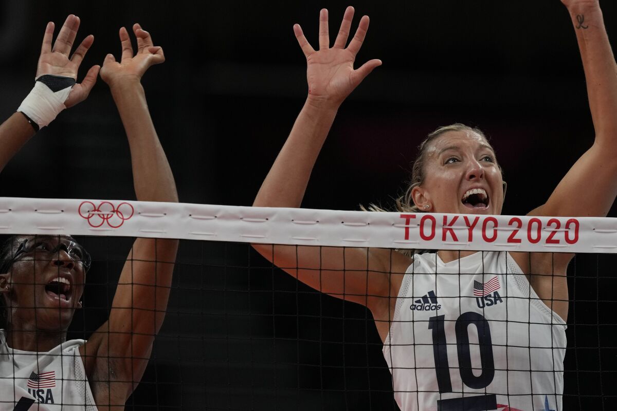 United States' Foluke Akinradewo, left, and United States' Jordan Larson try to block during the women's volleyball preliminary round pool B match between United States and Russian Olympic Committee at the 2020 Summer Olympics, Saturday, July 31, 2021, in Tokyo, Japan. (AP Photo/Frank Augstein)