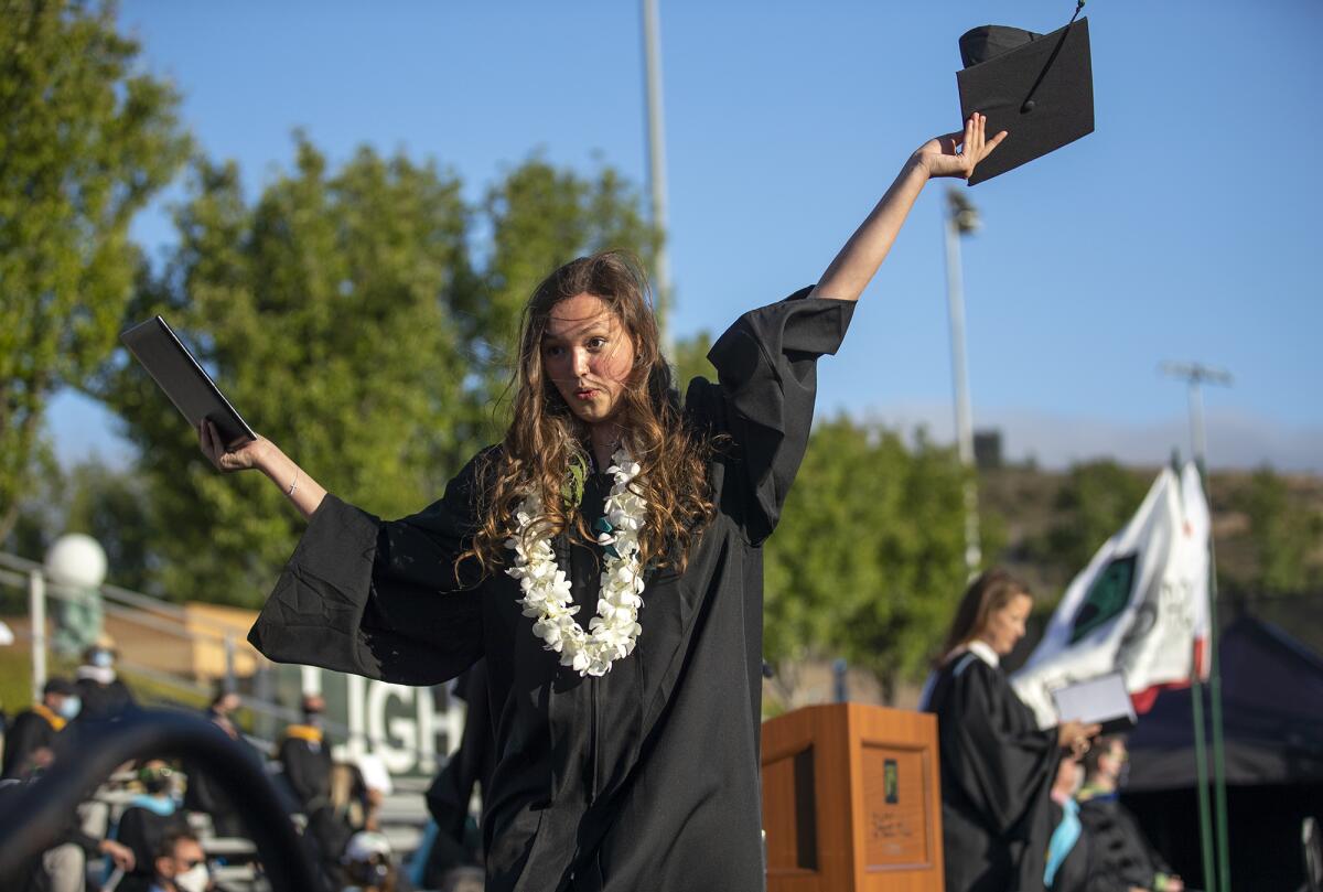 Reese Wensinger celebrates after receiving her diploma at Sage Hill School.