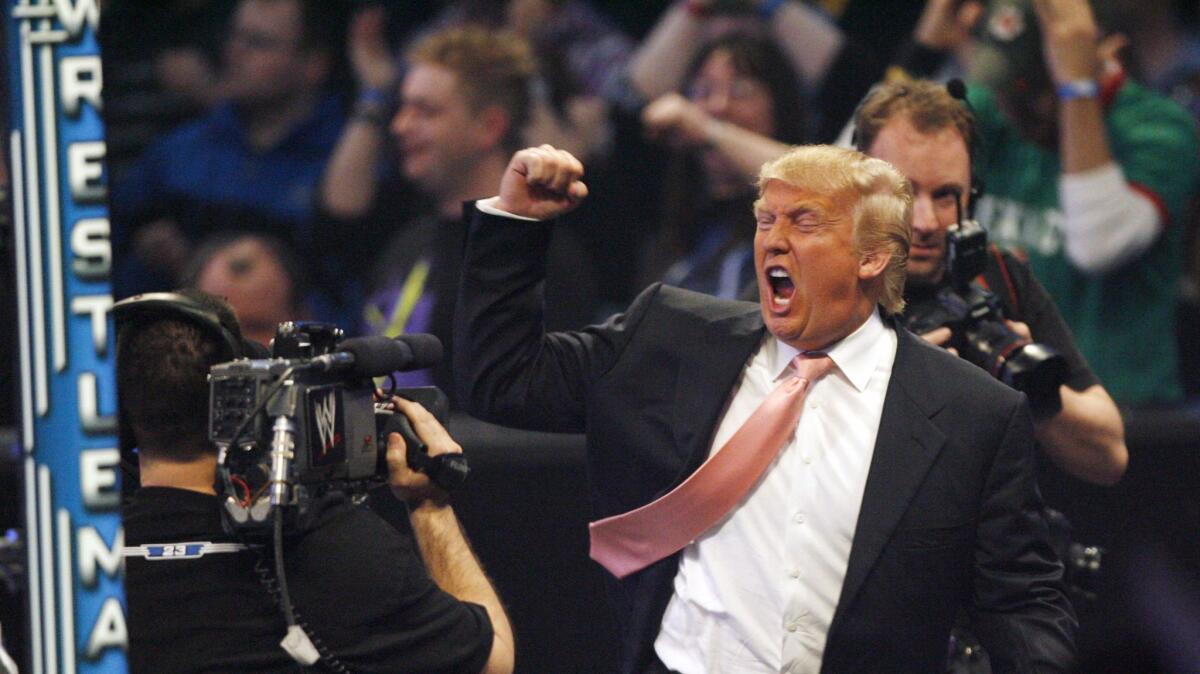 Donald Trump celebrates his victory over Vince McMahon in Hair vs. Hair, at WrestleMania 23, in 2007.