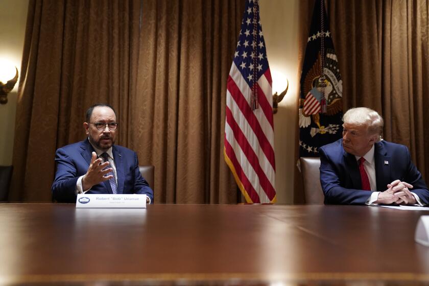 President Donald Trump listens as Robert Unanue, of Goya Foods, speaks during a roundtable meeting with Hispanic leaders in the Cabinet Room, Thursday, July 9, 2020, in Washington. (AP Photo/Evan Vucci)