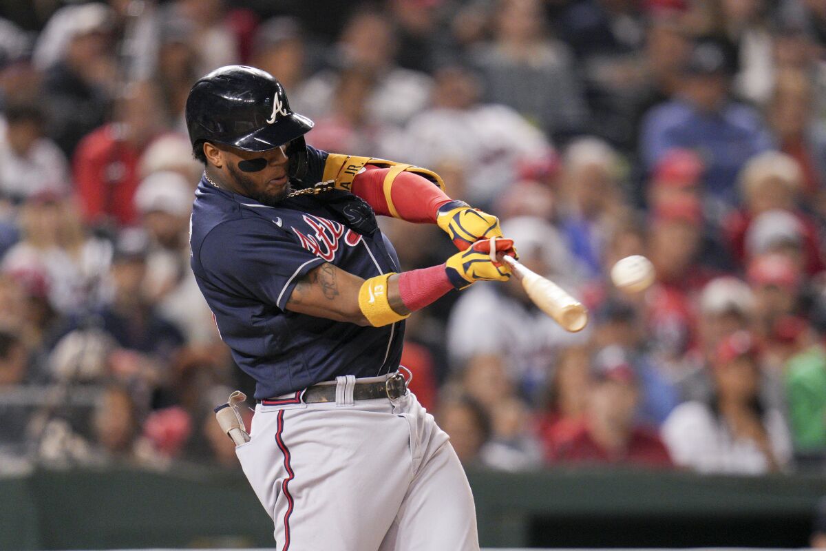 Atlanta Braves' Ronald Acuna Jr. hits a solo home run against the Washington Nationals during the fifth inning of a baseball game at Nationals Park, Tuesday, Sept. 27, 2022, in Washington. (AP Photo/Jess Rapfogel)