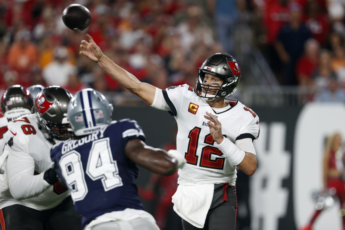 Tampa Bay Buccaneers quarterback Tom Brady (12) fires a pass against the Dallas Cowboys during the first half of an NFL football game Thursday, Sept. 9, 2021, in Tampa, Fla. (AP Photo/Scott Audette)