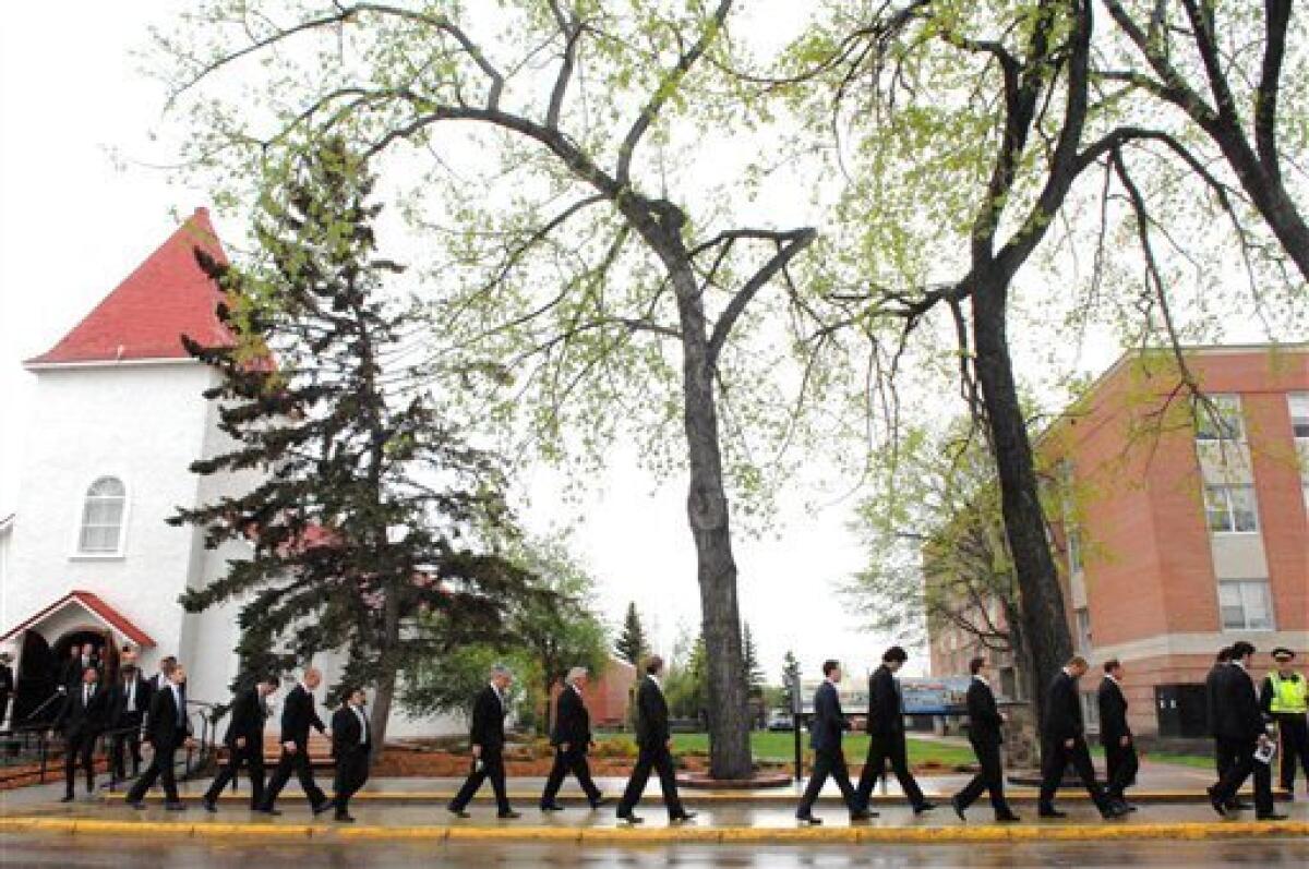 Brendan Shanahan, center-left, and other mourners leave the RCMP Depot  after the funeral service of Derek Boogaard in Regina, Saskatchewan, Canada  on Saturday, May 21, 2011. Boogaard, a professional hockey player who