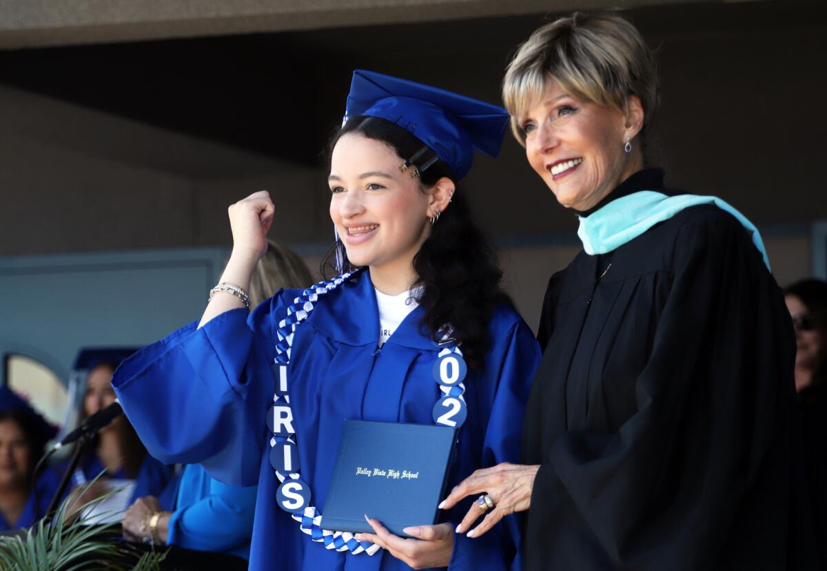 Valley Vista graduate Iris Ford celebrates after receiving her diploma on Thursday.