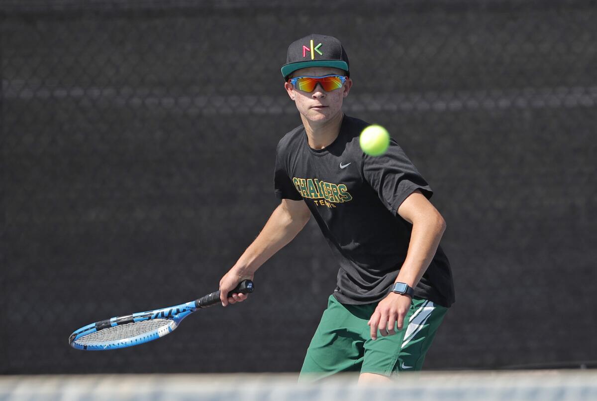 Edison's Clinton Cox hits a forehand in his match against Laguna Beach's Peter Durand on Monday.