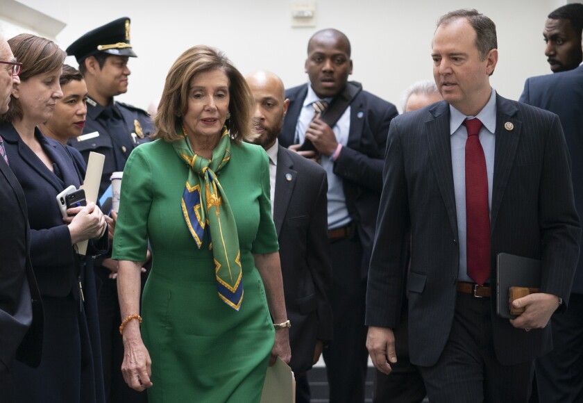 Speaker of the House Nancy Pelosi, D-Calif., joined by House Intelligence Committee Chairman Adam Schiff, D-Calif., leaves a lengthy closed-door meeting with the Democratic Caucus at the Capitol in Washington, Tuesday, Jan. 14, 2020. Speaker Pelosi is expected to appoint House impeachment managers and transmit the two articles of impeachment — abuse of power and obstruction of Congress — by the end of the week. (AP Photo/J. Scott Applewhite)