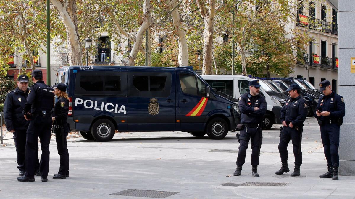 Police officers stand outside the National Court in Madrid on Thursday, Nov. 2, 2017.
