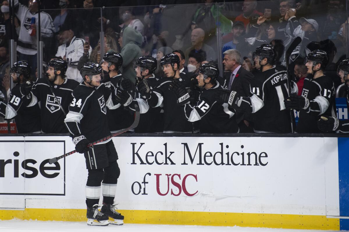 Kings left wing Arthur Kaliyev is congratulated for his goal against the St. Louis Blues.