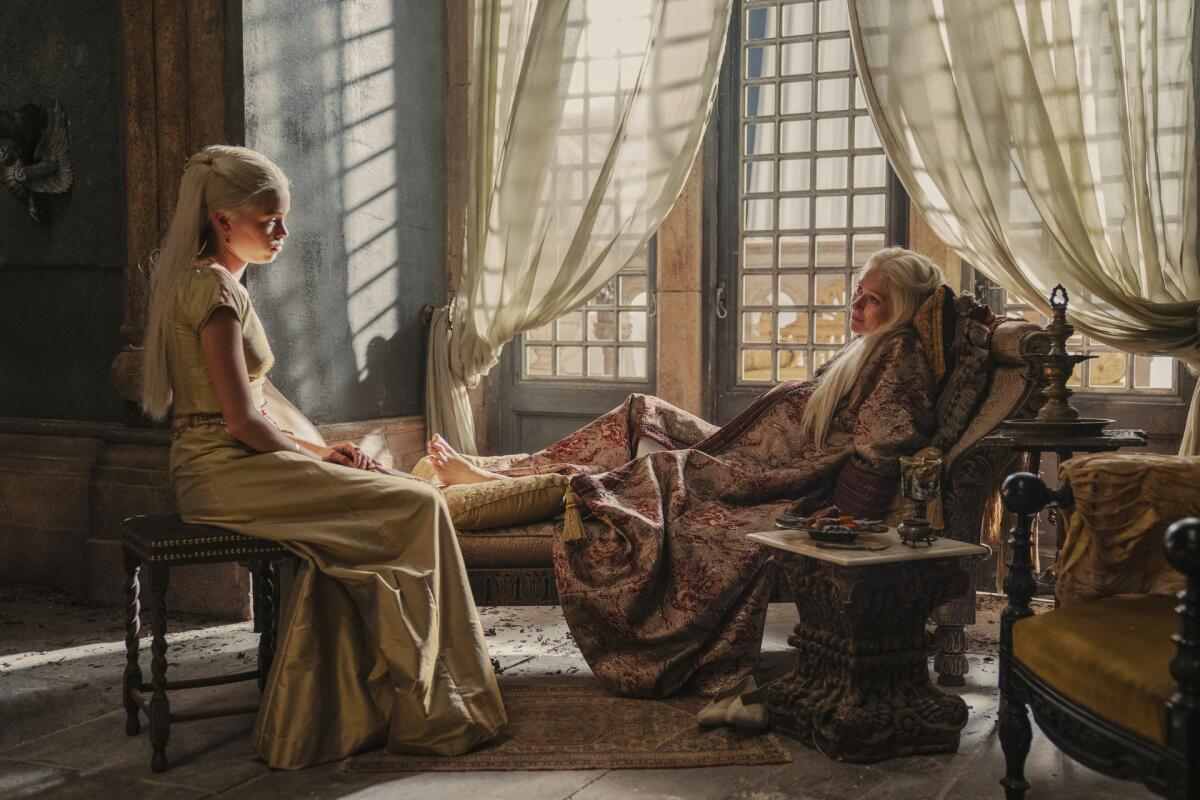 Two women sit in front of a window "House of the Dragon.”