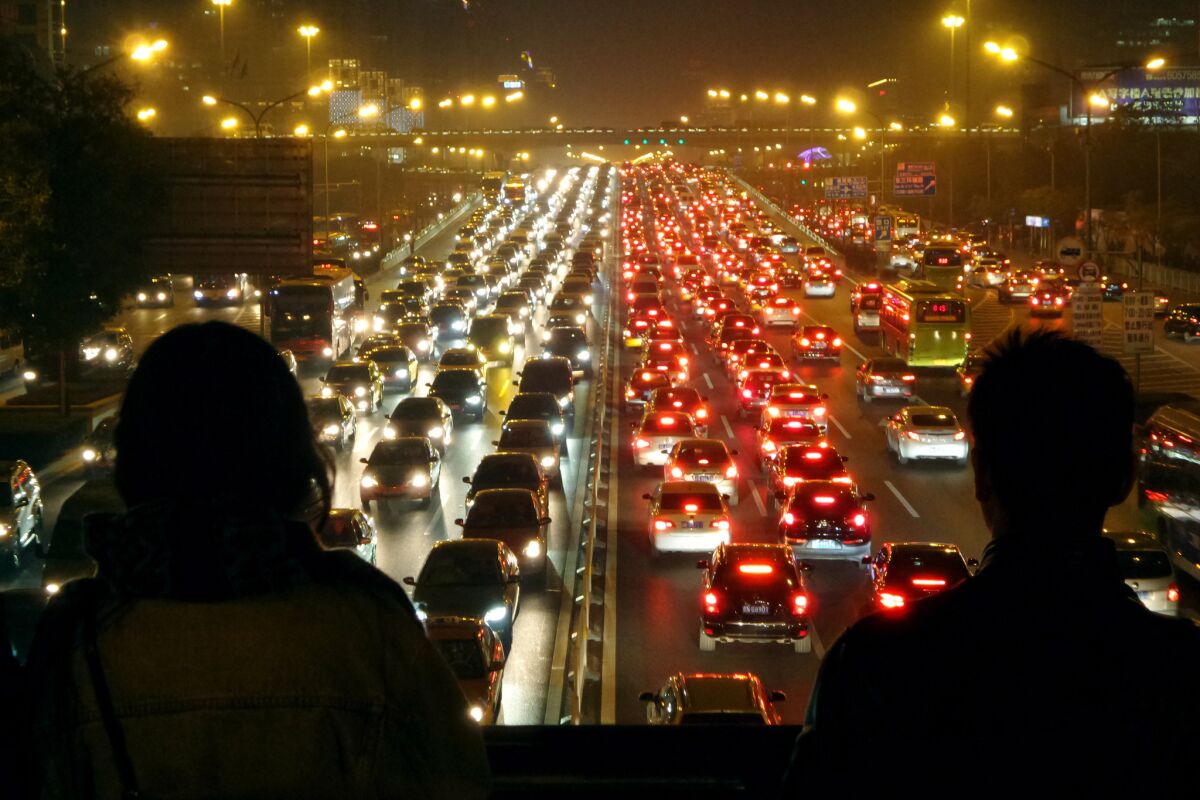 Traffic in Beijing. Plenty of drivers, plenty of riders.