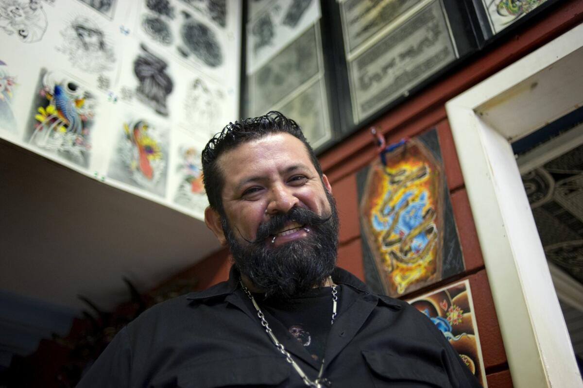 Alejandro Rancho Robledo lleva cerca de 20 años tatuando a los que buscan su arte en su estudio en el Mercado de Todos en Tijuana. David Maung